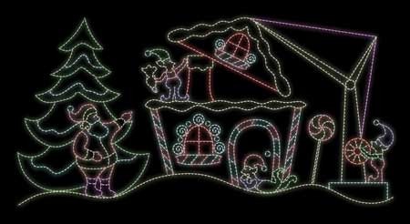SANTA BUILDING A GINGERBREAD HOUSE