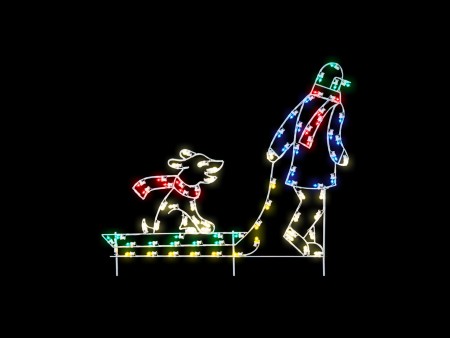 BOY PULLING SLED WITH DOG